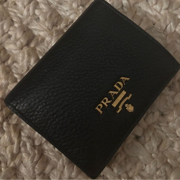 Real prada wallet black leather with red interior
Great condition - Picture 2 of 3
